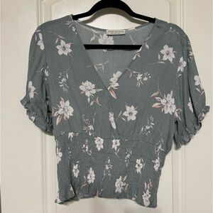 Cropped green floral blouse